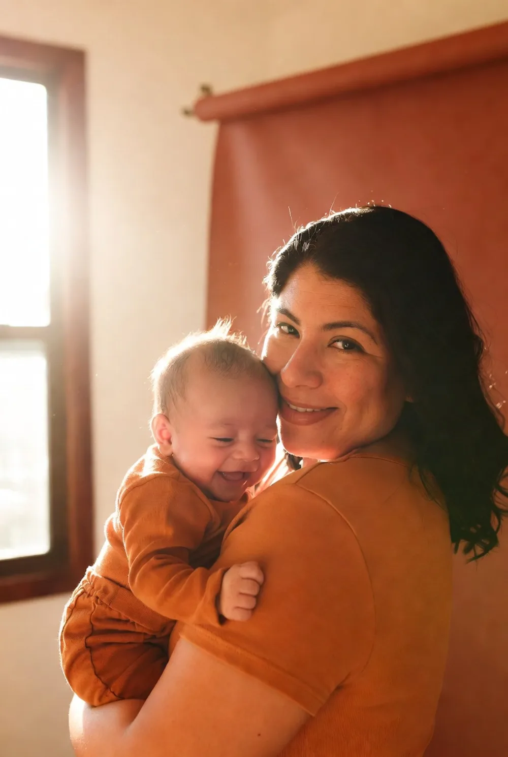 A mother and her daughter laughing together